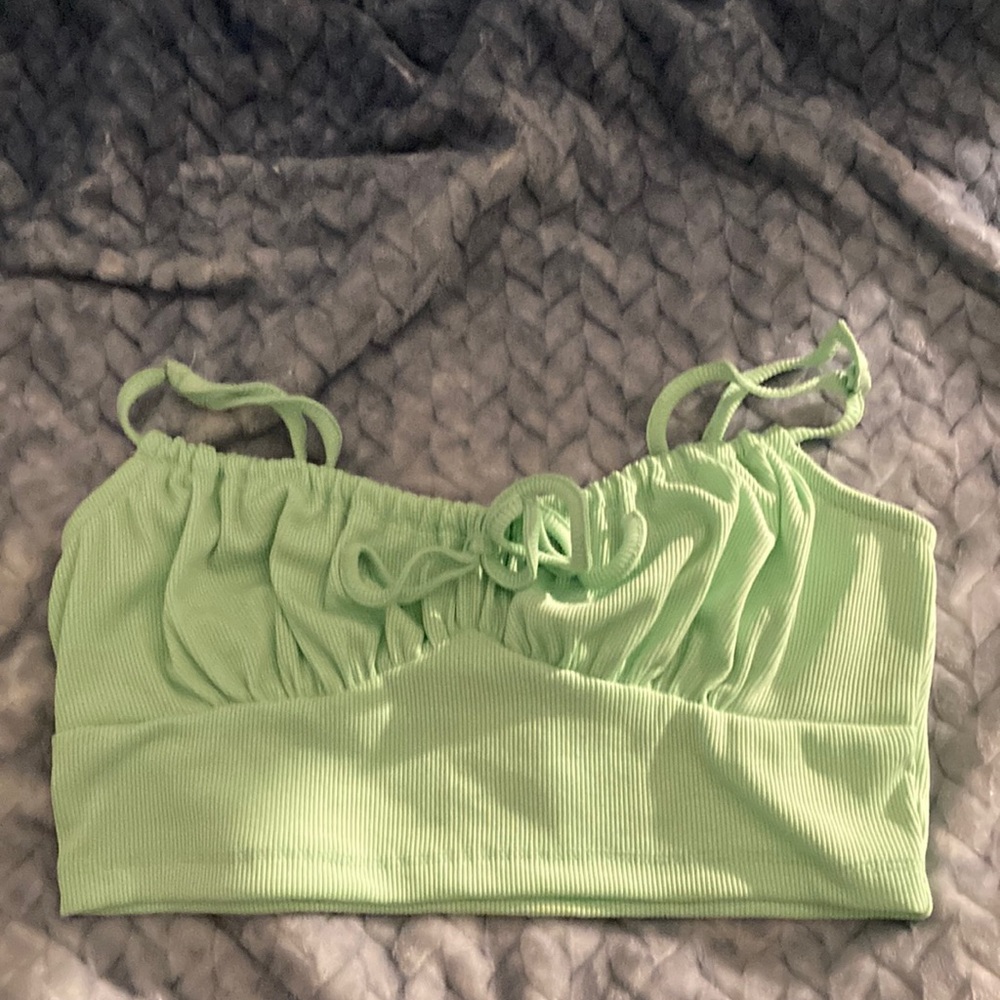 The brand is SHEIN, the color is a light mint green , the size is a small.